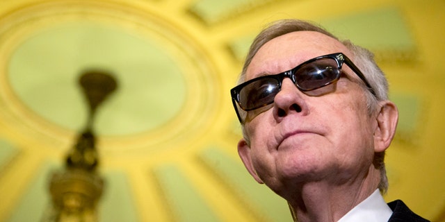 April 14, 2015: Senate Minority Leader Harry Reid of Nev. pauses during a news conference on Capitol Hill in Washington following a Senate policy luncheon.
