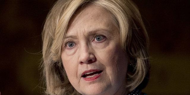 FILE - Dec. 3, 2014: Former Secretary of State Hillary Rodham Clinton speaks in Gaston Hall at Georgetown University, in Washington.