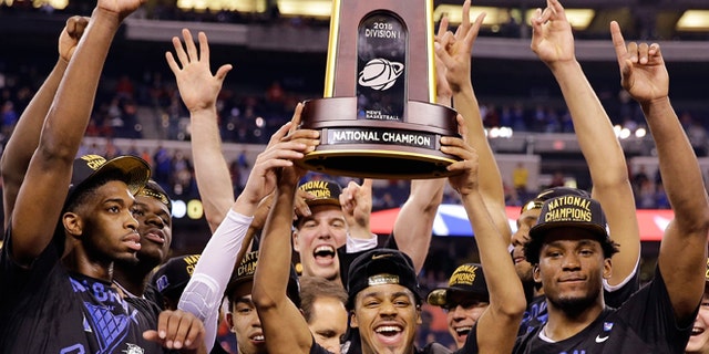 April 6, 2015: Duke players celebrate their 68-63 victory with the championship trophy over Wisconsin in the NCAA Final Four college basketball tournament championship game in Indianapolis.