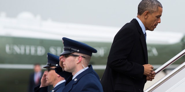Feb. 25, 2015: President Obama boards Air Force One at Andrews Air Force base, Md., for a trip to Miami.