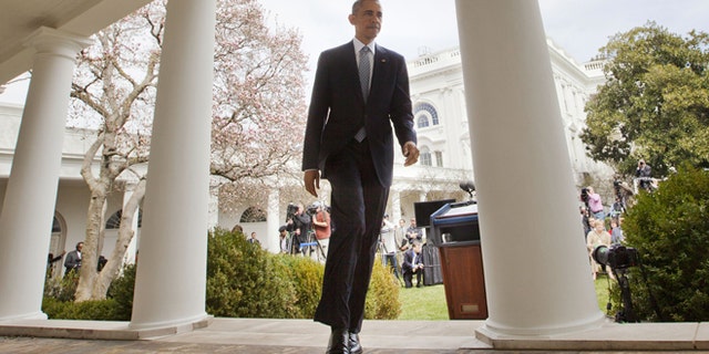 April 2, 2015: President Obama walks back to Oval Office from the Rose Garden of the White House in Washington.