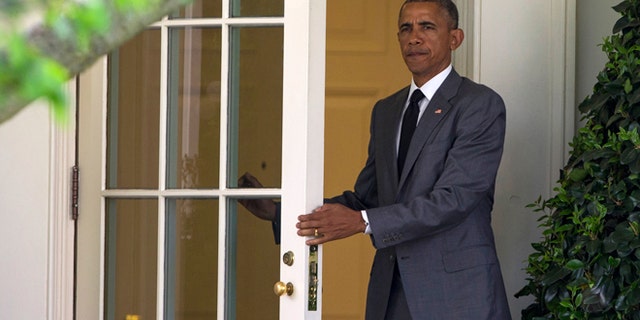 April 29, 2015: President Obama walks out of the Oval Office of the White House in Washington to board Marine One on the South Lawn for a trip to Walter Reed National Military Medical Center to meet with wounded veterans.