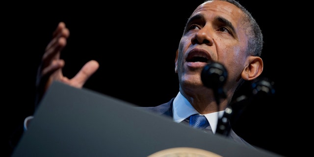 FILE - Dec. 4, 2013: President Obama speaks about the economy and growing economic inequality, at the Town Hall Education Arts Recreation Campus in Washington. The president said the income gap between America's rich and poor is a "defining challenge of our time."