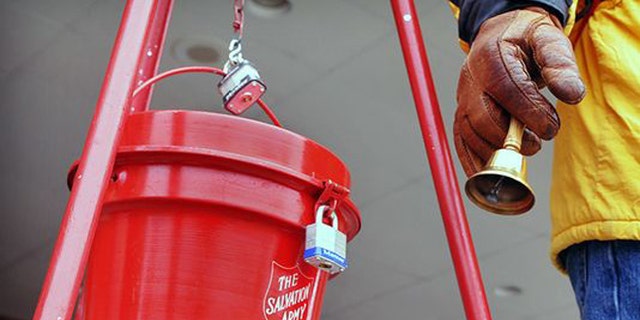 Salvation Army donation kettles and bell ringer