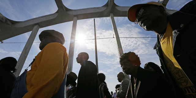 March 8, 2015: Crowds of people walk toward Selma after taking a symbolic walk across the Edmund Pettus Bridge in Selma, Ala.