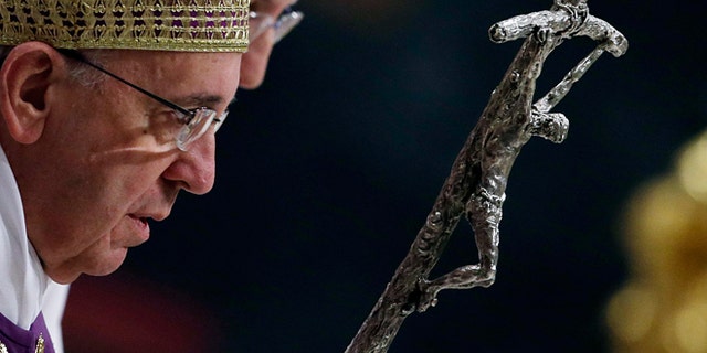 Nov. 30, 2013: Pope Francis arrives in St. Peter's Basilica to lead a Vesper prayer at the Vatican.