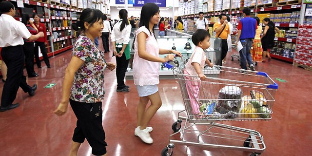 FILE -- Chinese customers shop at Walmart's first Sam's Club in China's southern city, Guangzhou.