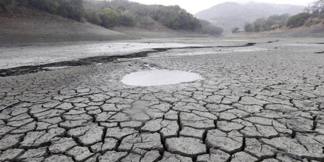 Feb. 7, 2014: This file photo shows the cracked-dry bed of the Almaden Reservoir in San Jose, Calif.