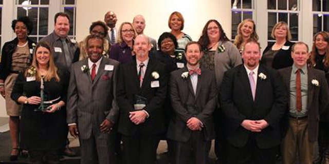 Kelly Hahn, pictured top row, third from right, a St. Louis Public Schools Teacher of the Year, says she has been fired on charges of child neglect and endangerment over an incident involving a pull-up diaper. (St. Louis Public Schools)