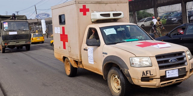 Aug. 1, 2014: Liberian soldiers in a medical truck drive past as they patrol streets to prevent panic, as fears of the deadly Ebola virus spread in the city of Monrovia, Liberia,.
