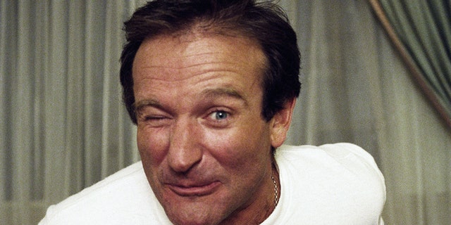 Comedian Robin Williams makes a face as he rises out of his chair during an interview, Nov. 15, 1993, New York. (AP Photo/Wyatt Counts)