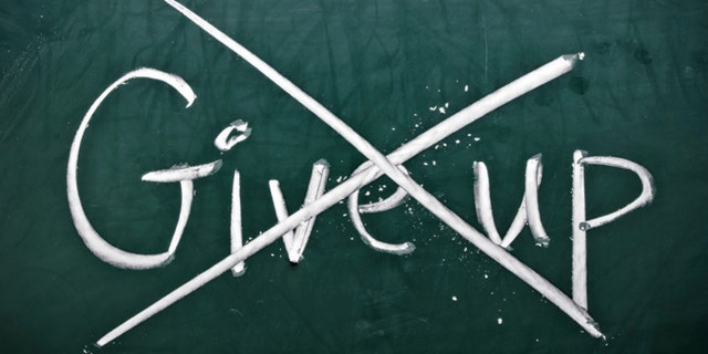 Do not give up, words on blackboard