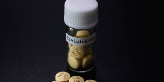 Tablets of Avigan (generic name : Favipiravir), a drug approved as an anti-influenza drug in Japan and developed by drug maker Toyama Chemical Co, a subsidiary of Fujifilm Holdings Co. are displayed during a photo opportunity at Fujifilm's headquarters in Tokyo October 22, 2014. Japan's Fujifilm Holdings Corp said on Monday it was expanding the production of its Avigan anti-influenza drug to reach an additional number of Ebola patients. France and Guinea plan to conduct clinical trials of Avigan 200 mg tablets, made by Fujifilm group company Toyama Chemical Co, in Guinea to treat Ebola in mid-November, Fujifilm said in a statement.