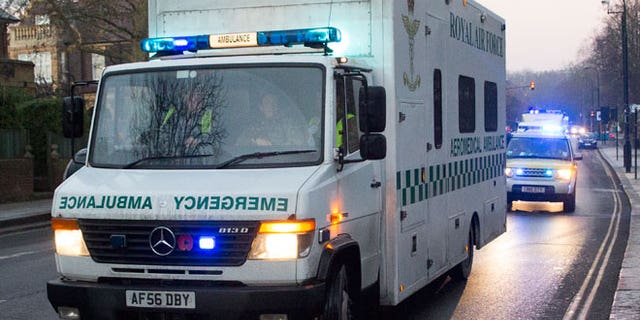 A convoy carrying a female Ebola patient arrives at the Royal Free Hospital in London December 30, 2014. The patient, a voluntary health worker, was flown to London for specialist treatment at an isolation ward after being taken ill a day after returning from Sierra Leone.