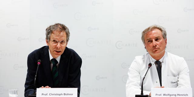 Christoph Buehrer, left, director of neonatology at Charite Hospital and Wolfgang Henrich, director of gynecology at Charite Hospital, brief the media about the situation of a 65-year old mother Annegret Raunigk and her quadruplets, in Berlin, Germany, Wednesday, May 27, 2015. Doctors say the quadruplets born prematurely to a 65-year-old Berlin woman are still in intensive care, but have been gaining a little weight and are being given their mother's milk through feeding tubes.