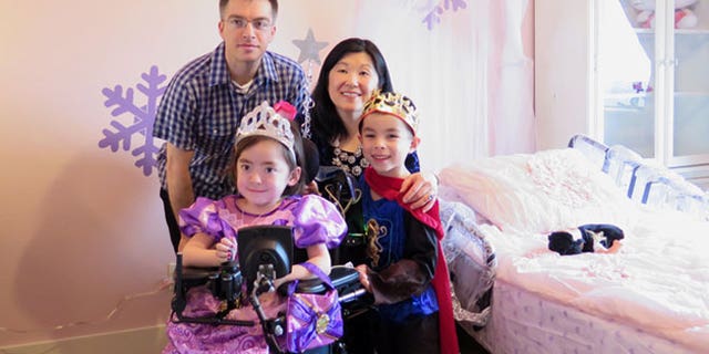 Julianna Snow, 5— pictured here with her father, Steve, her mother, Michelle Moon, and her older brother, Alex— suffers from a severe form of the inherited condition Charcot-Marie-Tooth disease, or CMT, that makes it impossible to eat on her own, play or walk. Her family told her at age 4 that the next time she got seriously ill, she could choose to either stay home and go to heaven or go back to the hospital.