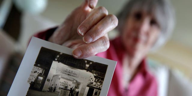 In this photo taken, Thursday, July 23, 2015, Beth Allen displays a photograph at her home in Hackensack, N.J., taken by her father after she was born premature in 1941. A century before reality TV, premature infants were put on display in primitive incubators. People paid 25 cents to see them at world's fairs, on the Atlantic City boardwalk, the sideshows at Coney Island and elsewhere. It was the only option for parents desperate to keep their babies alive, and Dr. Martin Couney did his best to oblige. From 1903 to 1943, Couney estimated, he kept alive 7,500 of the 8,500 children that passed through his incubator sideshows.