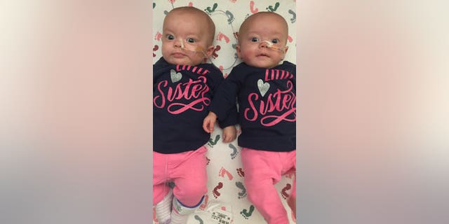 Kenedi and Kendal Breyfogle, 3-month-old identical twin girls from Pierre, South Dakota, are undergoing chemotherapy at the Mayo Clinic in Rochester, Minnesota, to treat acute myeloid leukemia (AML), a cancer that usually affects older adults.