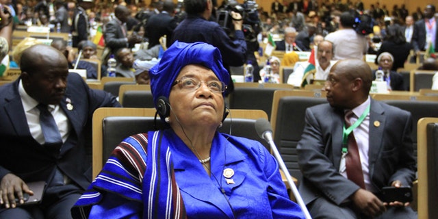 Liberian President Ellen Johnson-Sirleaf attends the opening ceremony of the 22nd Ordinary Session of the African Union summit in Ethiopia's capital Addis Ababa, January 30, 2014. The new president of Madagascar called on Thursday for an international donor conference in the next three months to help his island state recover from a political and economic crisis triggered by a coup five years ago. President Hery Rajaonarimampianina, who was sworn into office this month after elections passed off calmly in December, made his appeal at an African Union summit in Addis Ababa. REUTERS/Tiksa Negeri (ETHIOPIA - Tags: POLITICS) - RTX180W8