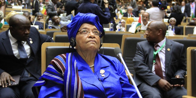 Liberian President Ellen Johnson-Sirleaf attends the opening ceremony of the 22nd Ordinary Session of the African Union summit in Ethiopia's capital Addis Ababa, January 30, 2014. The new president of Madagascar called on Thursday for an international donor conference in the next three months to help his island state recover from a political and economic crisis triggered by a coup five years ago. President Hery Rajaonarimampianina, who was sworn into office this month after elections passed off calmly in December, made his appeal at an African Union summit in Addis Ababa. REUTERS/Tiksa Negeri (ETHIOPIA - Tags: POLITICS) - RTX180W8