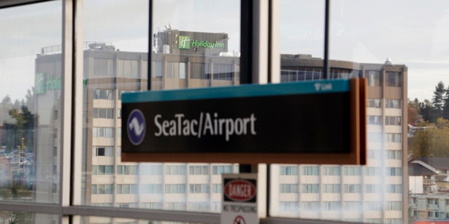 A Holiday Inn hotel is seen across from the light rail station at Seattle-Tacoma International Airport in SeaTac, Washington October 30, 2013. Voters in the working-class Seattle suburb of SeaTac, which encompasses the region's main airport, will decide on November 5, 2013 whether to enact one of the country's highest minimum wages in a ballot measure supporters hope will serve as a model for similar efforts elsewhere. Amid debate about income inequality in America, the ballot initiative in SeaTac, Washington, would mandate that 6,300 workers at Sea-Tac International Airport and nearby hotels, car rental agencies and parking lots receive a minimum hourly wage of $15, more than double the current federal minimum wage of $7.25. Picture taken October 30, 2013. REUTERS/Jason Redmond (UNITED STATES - Tags: POLITICS BUSINESS TRANSPORT EMPLOYMENT) - RTX150RP
