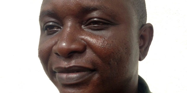 Sheik Umar Khan, head doctor fighting the deadly tropical virus Ebola in Sierra Leone, poses for a picture in Freetown, June 25, 2014. Khan, a Sierra Leonean virologist credited with treating more than 100 Ebola victims, has been transferred to a treatment ward run by medical charity Medecins Sans Frontieres after being infected by the Ebola virus, according to the statement released late on July 22, 2014 by the president's office. REUTERS/Umaru Fofana (SIERRA LEONE - Tags: HEALTH HEADSHOT) - RTR3ZTOE