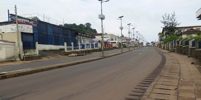An empty street is seen at the start of a three-day national lockdown in Freetown September 19, 2014. Sierra Leone began a three-day lockdown on Friday in an effort to halt the spread of the Ebola virus, as President Ernest Bai Koroma urged residents to comply with the emergency measures. REUTERS/Umaru Fofana