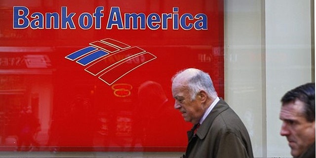 March 8: Pedestrians walk past a Bank of America sign on the street in New York.