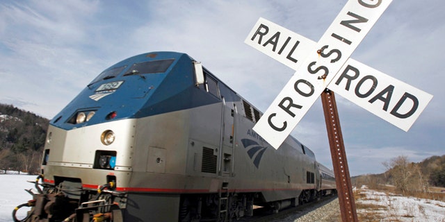 In this March 11, 2013 photo, the Amtrak Vermonter heads south in Middlesex, Vt. Amtrak says ridership has increased in the first six months of fiscal year 2013, with ridership in March setting a record as the single best month ever in Amtrak's history.