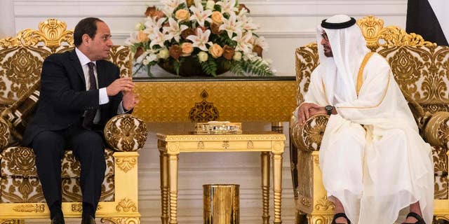 In this photo released by the Emirates News Agency, WAM, Egyptian President Abdel-Fattah El-Sissi, left, meets with the Crown Prince of Abu Dhabi and Deputy Supreme Commander of the UAE Armed Forces Sheikh Mohammed bin Zayed al-Nahayan, in Abu Dhabi, United Arab Emirates, Wednesday, May 3, 2017. (Ryan Carter/Crown Prince Court - Abu Dhabi, via AP)