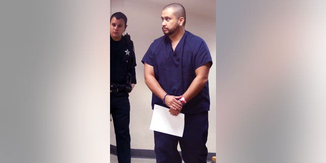 Zimmerman in handcuffs at the Seminole County Courthouse in Sanford, Fla. on Sat. Jan. 10, 2015.