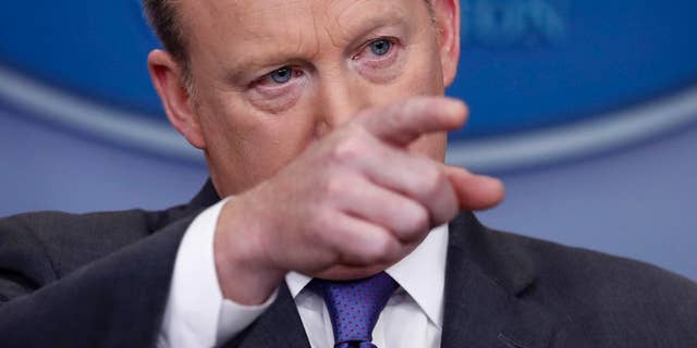 White House press secretary Sean Spicer points to a reporter to take a question during the daily news briefing at the White House in Washington, Monday, Jan. 30, 2017. Spicer discussed the weekend's immigration turmoil and other topics. (AP Photo/Carolyn Kaster)