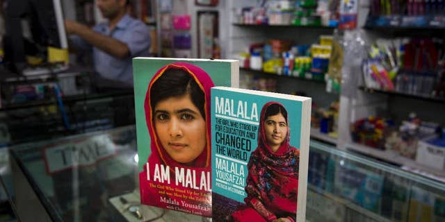 Books about Pakistan's Nobel Prize winner Malala Yousafzai, who survived a Taliban attack, are displayed at a book store in Islamabad, Pakistan, Thursday, April 30, 2015. A Pakistani court on Thursday sentenced 10 militants to life in prison for their involvement in the 2012 attack on teenage activist Malala Yousafzai, a public prosecutor said. (AP Photo/B.K. Bangash)