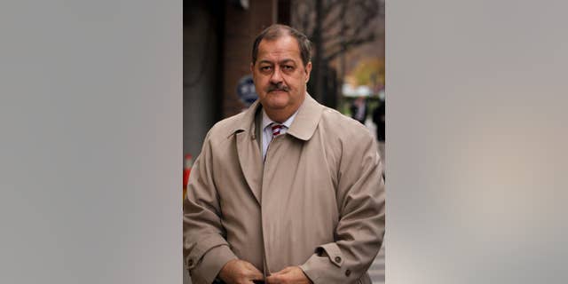FILE -In this  Tuesday, Dec. 1, 2015, file photo, Former Massey Energy CEO Don Blankenship makes his way out of the Robert C. Byrd U.S. Courthouse during a break in deliberations, Charleston, W.Va.  Jurors have resumed deliberations in ex-Massey Energy CEO Don Blankenship's trial. Thursday, Dec. 3, 2015. Jurors have said twice they couldn't agree on a verdict. They have deliberated for all or part of nine days. Blankenship is charged with conspiring to break safety laws and defrauding mine regulators at West Virginia's Upper Big Branch Mine and lying to financial regulators and investors about safety. The coal mine exploded in 2010, killing 29 men. (AP Photo/Tyler Evert)