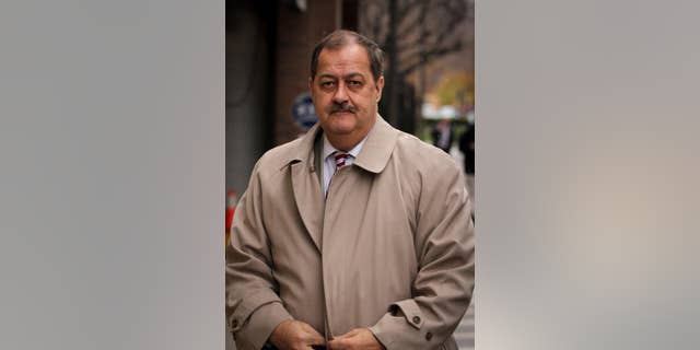 FILE -In this Tuesday, Dec. 1, 2015, file photo, Former Massey Energy CEO Don Blankenship makes his way out of the Robert C. Byrd U.S. Courthouse during a break in deliberations, Charleston, W.Va. Jurors have resumed deliberations in ex-Massey Energy CEO Don Blankenship's trial. Thursday, Dec. 3, 2015. Jurors have said twice they couldn't agree on a verdict. They have deliberated for all or part of nine days. Blankenship is charged with conspiring to break safety laws and defrauding mine regulators at West Virginia's Upper Big Branch Mine and lying to financial regulators and investors about safety. The coal mine exploded in 2010, killing 29 men. (AP Photo/Tyler Evert)