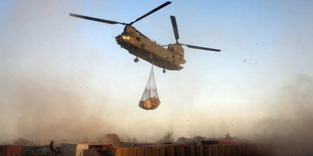 UPPER GERESHK VALLEY, AFGHANISTAN - JULY 9: A Royal Air Force Chinook helicopter delivers supplies to the British Paratroopers from the 2nd Battalion The Parachute Regiment on July 9, 2008 in Gibraltar FOB (Forward Operating Base) in Upper Gereshk Valley,Helmand Province, Afghanistan. The British Paratroopers from the 2nd Battalion The Parachute Regiment are deployed in the Upper Gereshk Valley with the aim of supporting the Afghan National Government in their fight against the Taliban and providing security for the local nationals. (Photo by Marco Di Lauro/Getty Images)