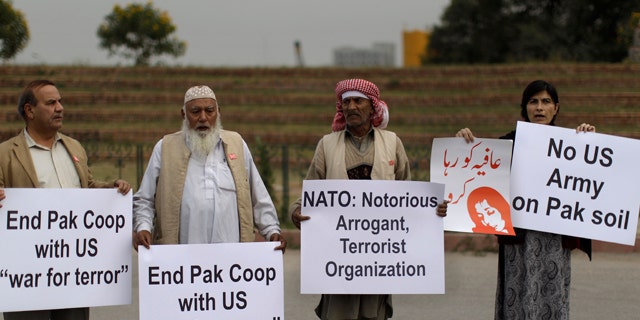 Dec. 1: Pakistanis hold placards and chant slogans during a protest to condemn NATO helicopters attacks on Pakistani troops, in Islamabad, Pakistan.