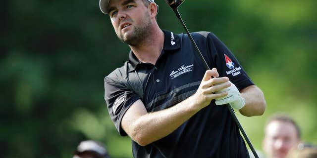 FILE - In this Aug. 2, 2014, file photo, Marc Leishman watches his drive on the third hole during the third round of the Bridgestone Invitational golf tournament at Firestone Country Club in Akron, Ohio. Lieshman, who has missed recent Tour events for family reasons, returns this week at the Zurich Classic in New Orleans. (AP Photo/Mark Duncan, File)
