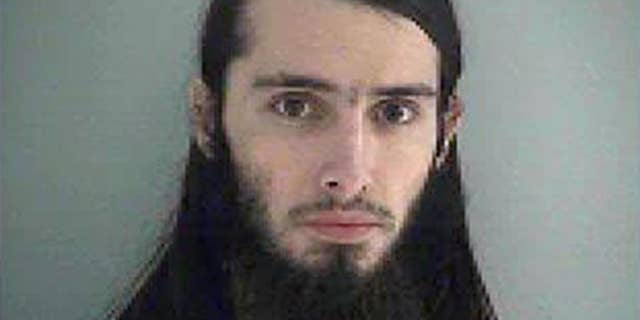 FILE-This Wednesday Jan. 14, 2015 file photo made available by the Butler County Jail shows Christopher Lee Cornell. The attorney for Cornell, an Ohio man accused of plotting to attack the U.S. Capitol building Monday asked a federal judge to allow the man a private review of video and audio files in the case against him. (AP Photo/Butler County Jail, File)