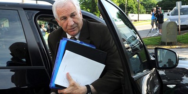 June 14, 2012: Former Penn State University assistant football coach Jerry Sandusky arrives for the fourth day of his trial at the Centre County Courthouse in Bellefonte, Pa.