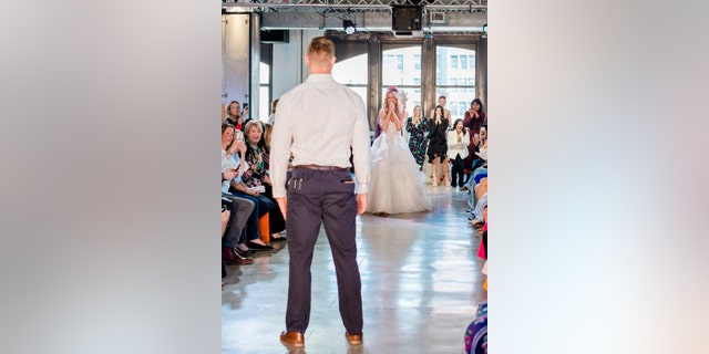 Nicole Kaspar was shocked to find boyfriend Chris Stapleton at the end of the runway.