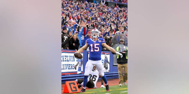 Buffalo Bills wide receiver Chris Hogan celebrates after scoring a touchdown against the Cleveland Browns during the second half of an NFL football game, Sunday, Nov. 30, 2014, in Orchard Park, N.Y. (AP Photo/Bill Wippert)