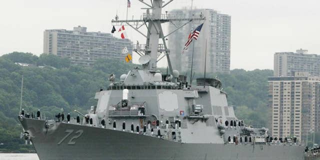 FILE - In this May 26, 2004 file photo, the USS Mahan, a guided-missile destroyer, moves up the Hudson River in New York during Fleet Week. A U.S. Navy guided-missile destroyer fired a warning flare toward an Iranian Revolutionary Guard vessel coming near it in the Persian Gulf, an American official said Wednesday, the latest tense naval encounter between the two countries. (AP Photo/Ed Bailey, File)