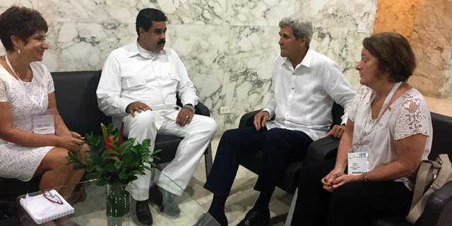 U.S. Secretary of State John Kerry meets with Venezuela president Nicolas Maduro in Cartagena, Colombia Monday, Sept. 26, 2016. (AP Photo/Vivian Salama)