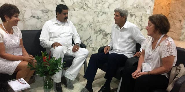 U.S. Secretary of State John Kerry meets with Venezuela president Nicolas Maduro in Cartagena, Colombia Monday, Sept. 26, 2016. (AP Photo/Vivian Salama)