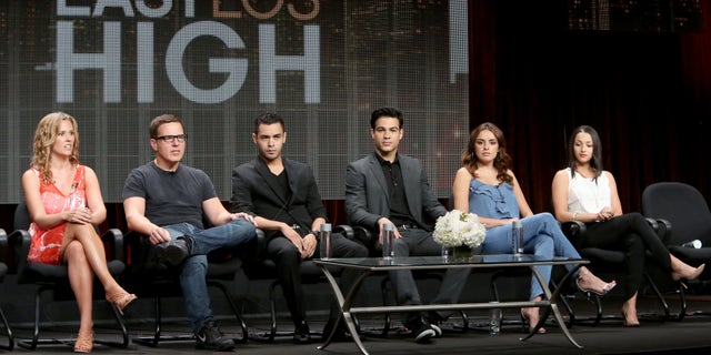 BEVERLY HILLS, CA - JULY 12: : (L-R) Executive producer Katie Elmore Mota, director/executive producer Carlos Portugal, actors Gabriel Chavarria, Ray Diaz, Vannessa Vasquez and Danielle Vega speak onstage during the 'East Los High' panel at Hulu's TCA Presentation at The Beverly Hilton Hotel on July 12, 2014 in Beverly Hills, California. (Photo by Jesse Grant/Getty Images for Hulu)