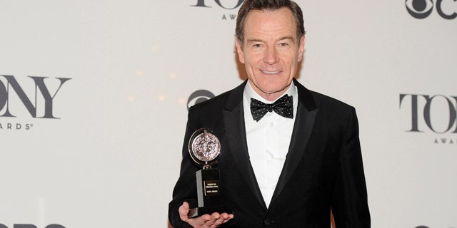 June 8, 2014: Bryan Cranston poses with his award for best actor in a play for 'All the Way' in the press room at the 68th annual Tony Awards at Radio City Music Hall in New York. (Photo by Charles Sykes/Invision/AP)