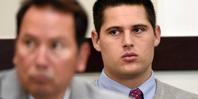 Brandon Vandenburg, right, a former Vanderbilt football player, listens during his rape trial Saturday, June 18, 2016, in Nashville, Tenn. A jury earlier convicted Vandenburg after a trial that featured graphic cellphone videos and photos of the attack taken by the former players. However, the verdict was thrown out after it was discovered that the jury foreman had been a victim of statutory rape. (Larry McCormack, The Tennessean via AP)