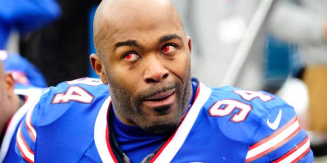 Kansas City Chiefs strong safety Ron Parker, left, forces a fumble off Buffalo Bills running back Bryce Brown during the second half of an NFL football game, Sunday, Nov. 9, 2014, in Orchard Park, N.Y. (AP Photo/Bill Wippert)