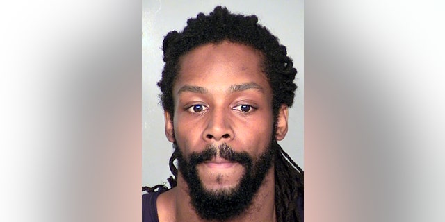 This image provided by the Clark County Detention Center shows Kirk Bills, who has been accused of trying to burn a pet shop where 27 puppies were rescued last month. Bills has been returned in custody to Las Vegas to face arson and other charges, authorities said Thursday, Feb. 20, 2014. (AP Photo/Clark County Detention Center)